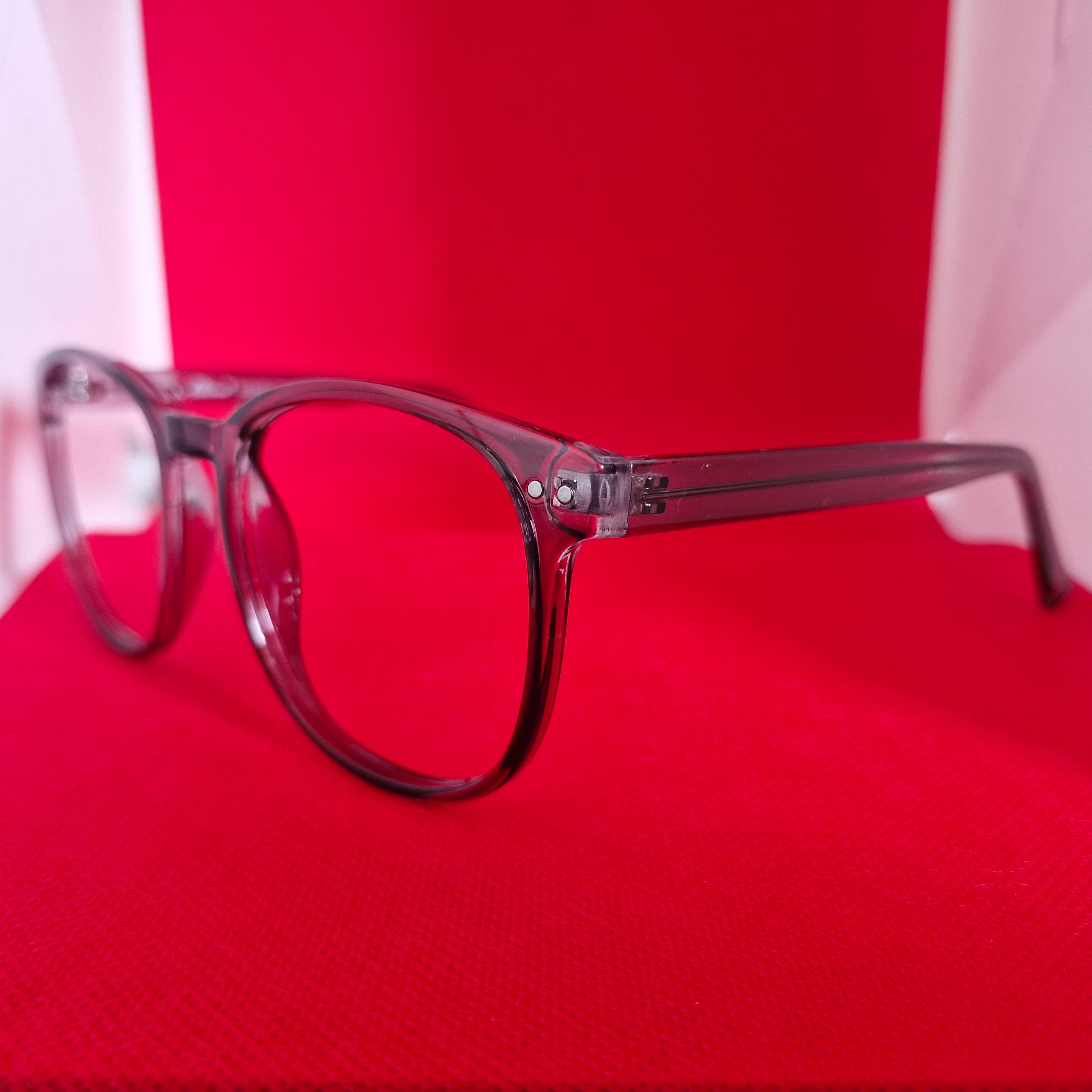Armazón de Acetato gris transparente marca ALTERNA + Cristales Ópticos CR39 con capa AR, protección 100% UV.