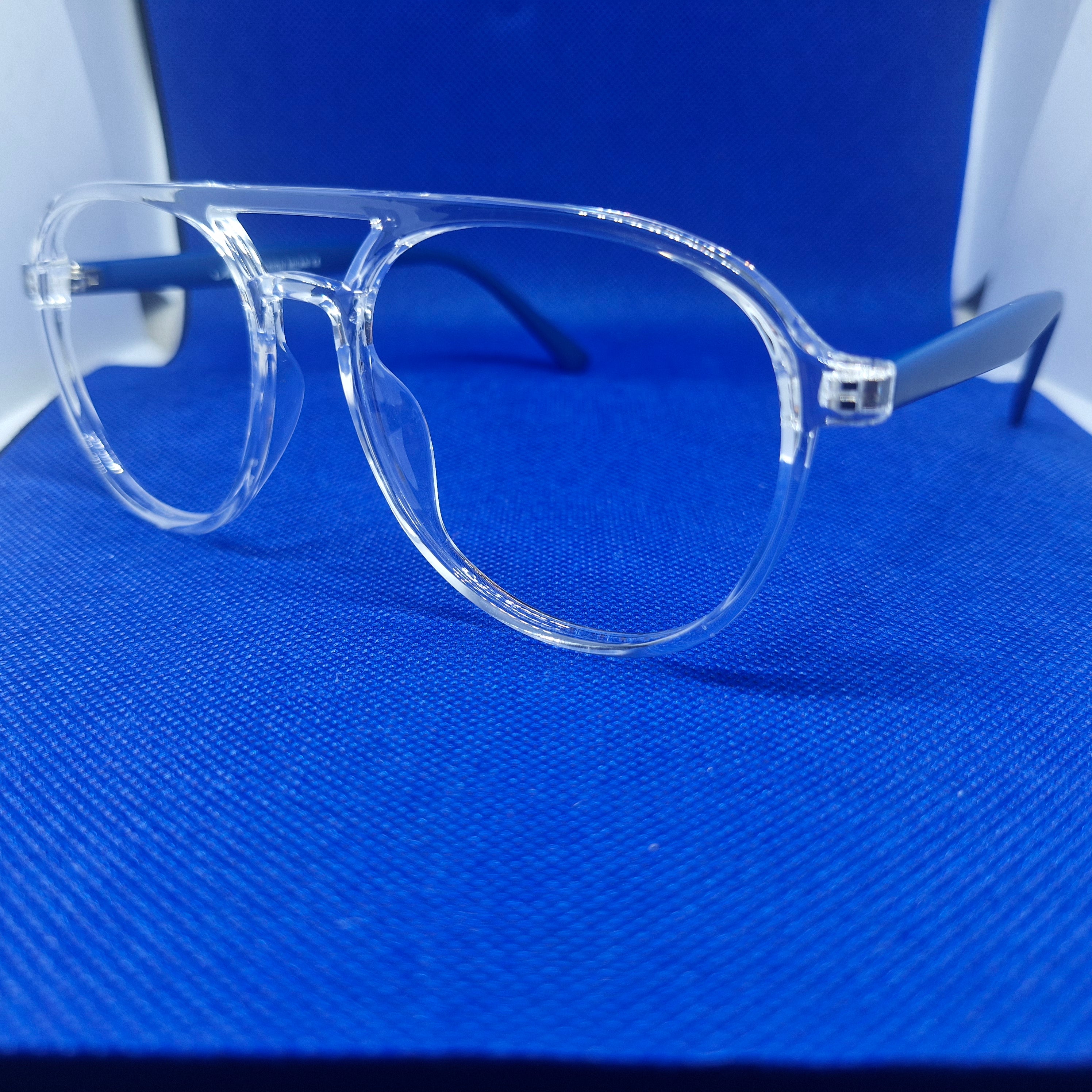 Armazón de ACETATO marca ALTERNA (transparente y varillas azules) + Cristales Ópticos CR39 con capa AR, protección 100% UV.