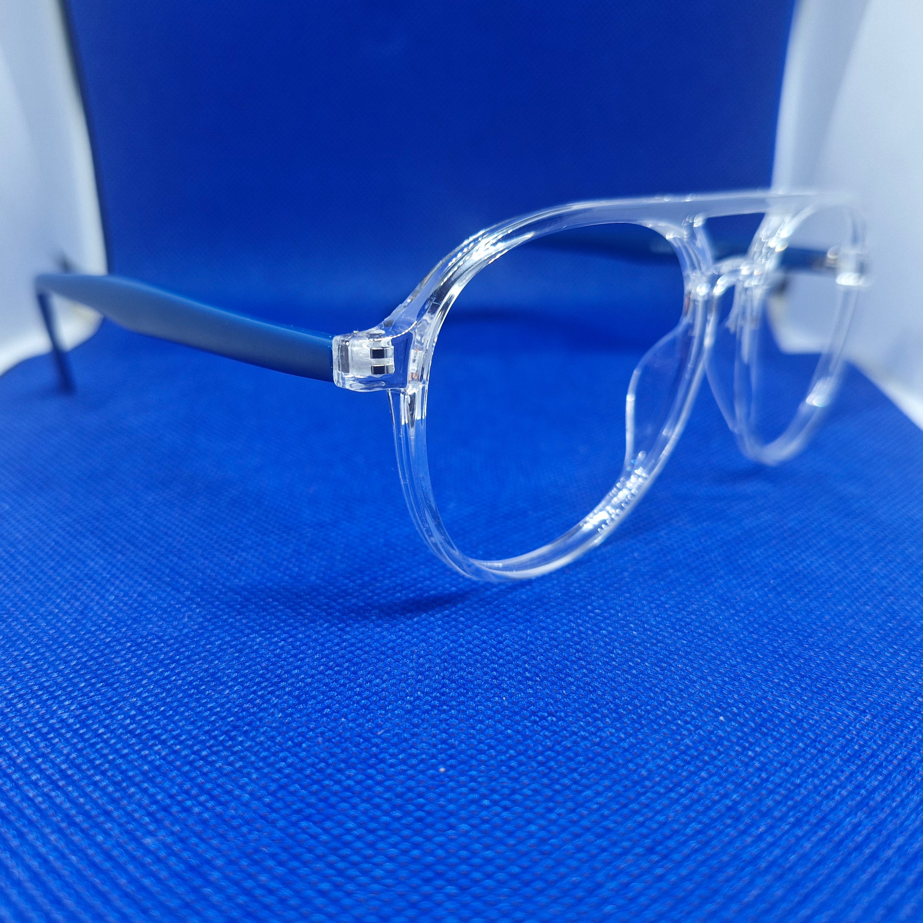 Armazón de ACETATO marca ALTERNA (transparente y varillas azules) + Cristales Ópticos CR39 con capa AR, protección 100% UV.