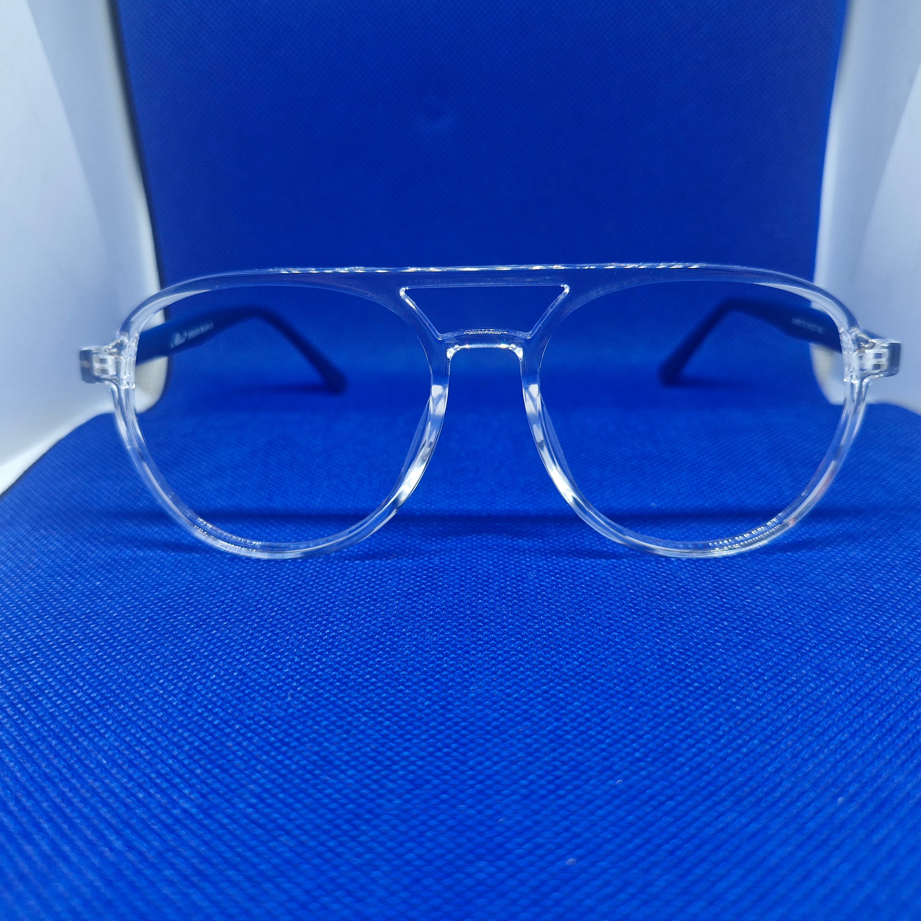 Armazón de ACETATO marca ALTERNA (transparente y varillas azules) + Cristales Ópticos CR39 con capa AR, protección 100% UV.