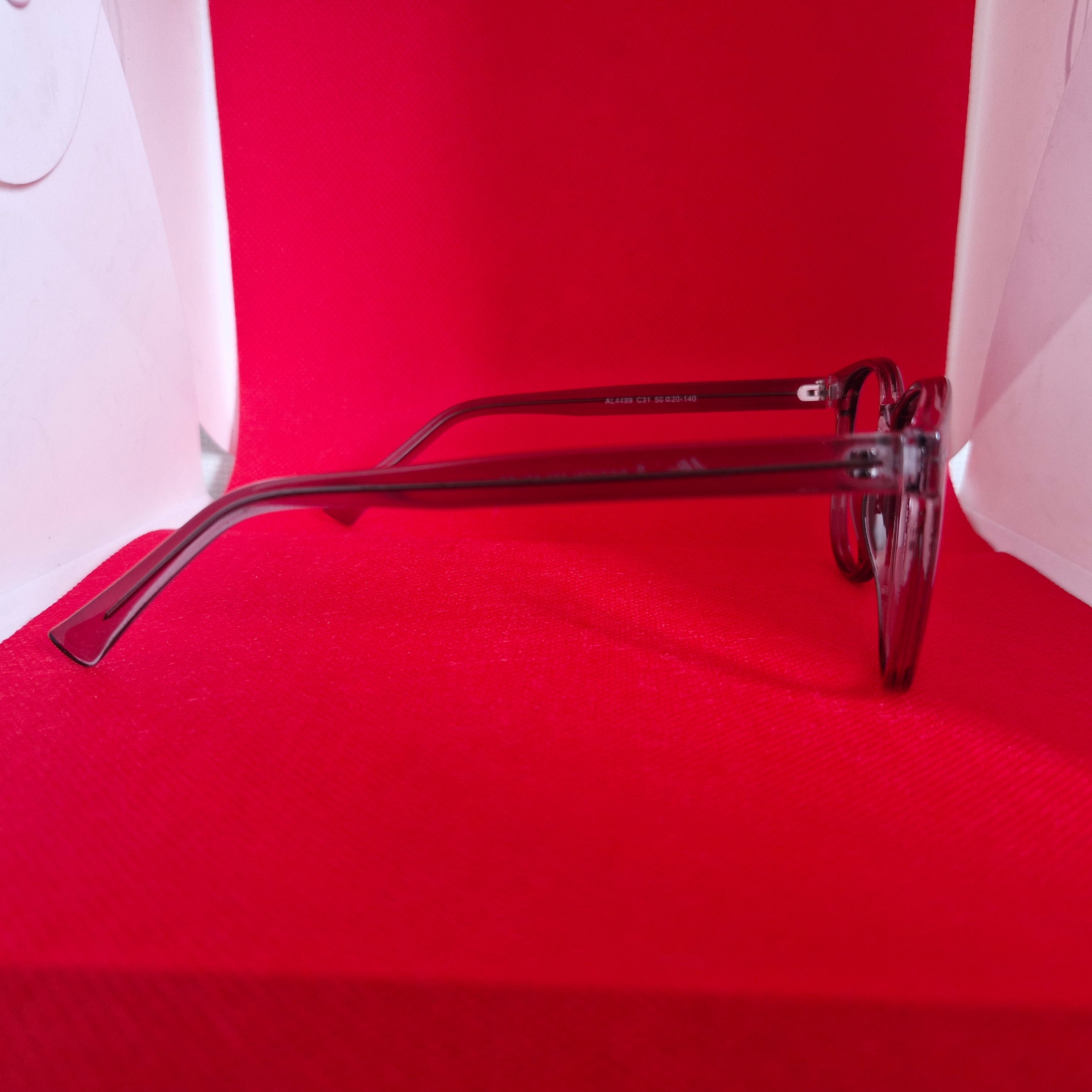 Armazón de Acetato gris transparente marca ALTERNA + Cristales Ópticos CR39 con capa AR, protección 100% UV.