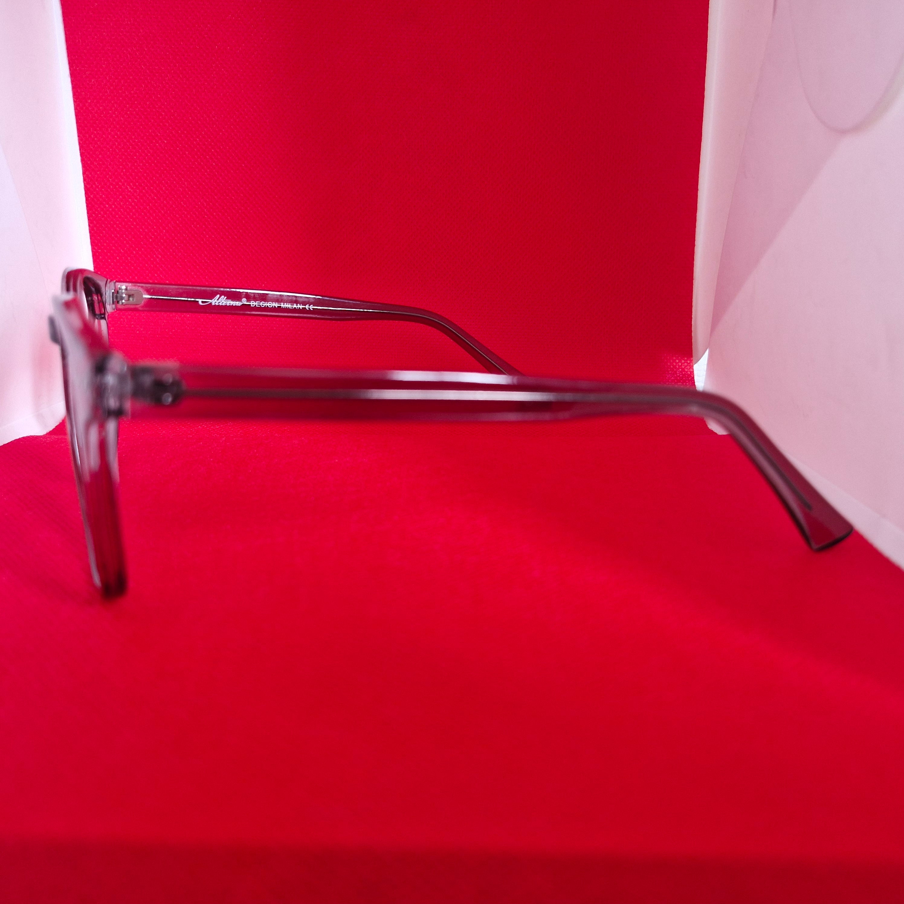 Armazón de Acetato gris transparente marca ALTERNA + Cristales Ópticos CR39 con capa AR, protección 100% UV.